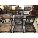 SEVEN REGENCY CHAIRS WITH WICKER SEATS AND BACKS ON TURNED OUT LEGS (ONE AF)