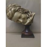 A 19TH CENTURY LOST WAX SCULPTURE OF A FEMALE BUST, MOUNTED UPON A TURNED WOODEN BASE, 38CM HIGH