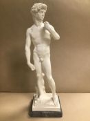 A LARGE RESIN SCULPTURE OF A NUDE MALE IN THE CLASSICAL STYLE, RAISED UPON MARBLE BASE OF SQUARE