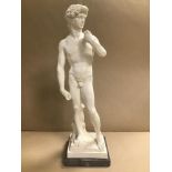 A LARGE RESIN SCULPTURE OF A NUDE MALE IN THE CLASSICAL STYLE, RAISED UPON MARBLE BASE OF SQUARE