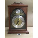 AN URGOS WEST GERMAN MANTLE CLOCK, THE SILVERED DIAL WITH ROMAN NUMERALS DENOTING HOURS, UNDER THE