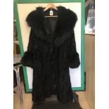 A VINTAGE FULL-LENGTH BLACK ASTRAKHAN COAT WITH FUR TO THE NECKLINE AND SLEEVES, SIZE 12