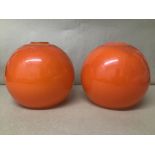 A PAIR OF RETRO 1960'S/70'S ORANGE GLASS LAMP SHADES OF GLOBULAR FORM