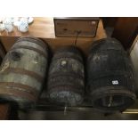 THREE VINTAGE FRENCH WOODEN BARRELS ON WOODEN STANDS