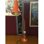 A VINTAGE HERBERT TERRY ANGLEPOISE LAMP IN ORANGE