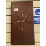 A VINTAGE RETRO WALL CLOCK IN ROSEWOOD BATTERY OPERATED