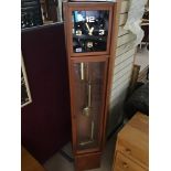 A RETRO TEAK GRANDFATHER CLOCK