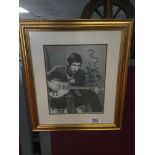 A FRAMED AND GLAZED PRINT OF PETE TOWNSEND SIGNED 38 X44CMS