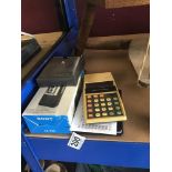 A COMMODORE 887D CALCULATOR, SONY M-740 CASSETTE RECORDER, ACCURON CALCULATOR AND ANOTHER