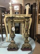 A PAIR OF EARLY 19TH CENTURY BRASS CANDLE LAMPS