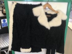 A VINTAGE THREE PIECE BLACK AND CREAM ASTRAKHAN SUIT (JACKET, SKIRT, AND MATCHING BAG) SIZE 12
