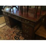 A GEORGIAN RED LEATHER TOP PARTNERS DESK