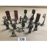 A COLLECTION OF LEAD FIGURES, INCLUDING UNUSUAL TICKET MACHINE AND WEIGHING SCALES
