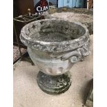 A CONCRETE PLANTER ON BASE WITH GARGOYLES ON SIDES 63CMS HIGH
