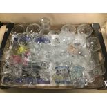 A COLLECTION OF CLEAR DRINKING GLASSES INCLUDING SOME EARLY ETCHED ONES