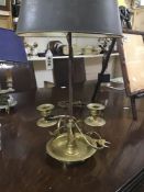 A LATE 19TH CENTURY CANDLE LAMP IN BRASS