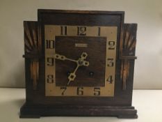 A 20TH CENTURY ART DECO OAK CASED MANTLE CLOCK BY JAMES WALKER LTD, DIAL OF SQUARE FORM WITH