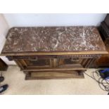 A CONTINENTAL WOOD AND MARBLE TOP A/F UNIT WITH TWO DRAWERS AND CUPBOARD WITH KEY
