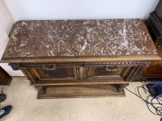 A CONTINENTAL WOOD AND MARBLE TOP A/F UNIT WITH TWO DRAWERS AND CUPBOARD WITH KEY