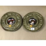 A PAIR OF BRASS AND PORCELAIN WALL PLAQUES