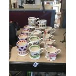 FOURTEEN EMMA BRIDGEWATER CERAMIC CUPS IN DIFFERENT DESIGNS, INCLUDING MEN AT WORK, GYMKHANA AND