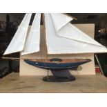 A MASTED POND YACHT RAISED UPON STAND, 81CM HIGH