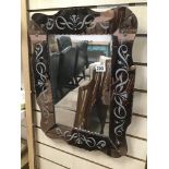 A GLASS FRAMED BEVELLED EDGED MIRROR, 61CM HIGH