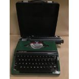 A SILVER-REED SILVERETTE II TYPEWRITER WITH LID