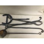 A GROUP OF LARGE IRON TOOLS, INCLUDING METAL POURING FOUNDRY LADLE, TONGS ETC