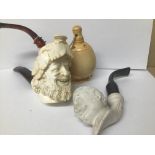 TWO MEERSCHAUM PIPES, ONE CARVED AS A MALE BUST, THE OTHER LIDDED, TOGETHER WITH A CERAMIC PIPE BY