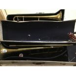 A VINTAGE BRASS RENOWN TROMBONE WITH CASE