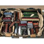 AN ASSORTMENT OF MODEL RAILWAY CARRIAGES AND WAGONS, MOST BY HORNBY DUBLO AND TRI-ANG