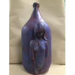 AN UNUSUAL LARGE CONTINENTAL ART POTTERY VASE, PURPLE IN COLOUR, A STYLISED NUDE FEMALE ADORNING THE