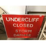 A VINTAGE METAL SIGN (UNDERCLIFF CLOSED STORM DAMAGE) 92 X 76CMS