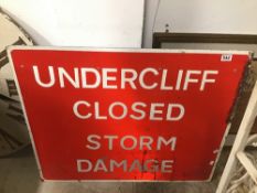 A VINTAGE METAL SIGN (UNDERCLIFF CLOSED STORM DAMAGE) 92 X 76CMS