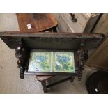 A VINTAGE BRACKET SHELF WITH TWO TILES