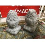 TWO RECONSTITUTED STONE FIGURAL ACORNS 33CMS