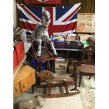 A VINTAGE WOODEN ROCKING HORSE with A VINTAGE METAL ROCKING HORSE