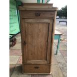 A PINE CUPBOARD WITH KEY AND TWO DRAWERS 154 X 42 X 73CMS