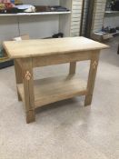 A LIGHT OAK TWO TIER TABLE WITH DECORATED LEGS 100 X 54 X 764CMS