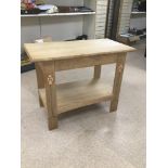 A LIGHT OAK TWO TIER TABLE WITH DECORATED LEGS 100 X 54 X 764CMS