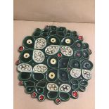 A GUSTAVSBERG SWEDISH ART POTTERY WALL PLAQUE OF CIRCULAR FORM, ORIGINAL LABEL PRESENT TO THE