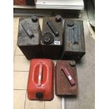 FIVE VINTAGE PETROL CANS INCLUDING SHELL WITH BRASS STOPPERS