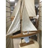 A MASTED POND YACHT ON STAND, 79CM HIGH