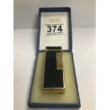 A GOLD PLATED AND BLACK LACQUER DUNHILL LIGHTER, PATENT 24163