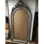 A LARGE SILVER FRAME WITH ORNATE DECORATION 110 X 227CMS