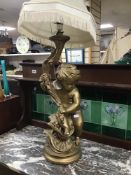A LARGE GILDED PLASTER FIGURAL LAMP, 100CM HIGH INC SHADE