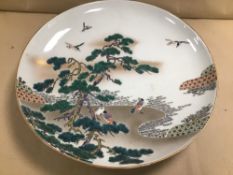 A LARGE 19TH CENTURY JAPANESE PORCELAIN CHARGER, DECORATION DEPICTING BIRDS AMONGST TREES, CHARACTER