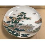 A LARGE 19TH CENTURY JAPANESE PORCELAIN CHARGER, DECORATION DEPICTING BIRDS AMONGST TREES, CHARACTER