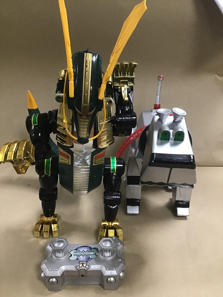 A POWER RANGERS DRAGON ZORD TOY, TOGETHER WITH A MEGA-BYTE DOG